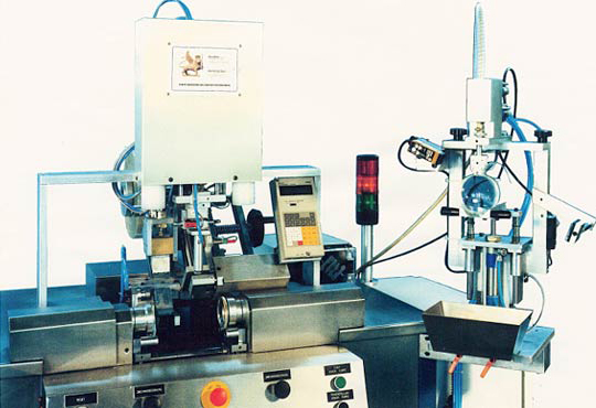 Mould assembly and automatic filling line for the production of CR39 lenses (optical industry).